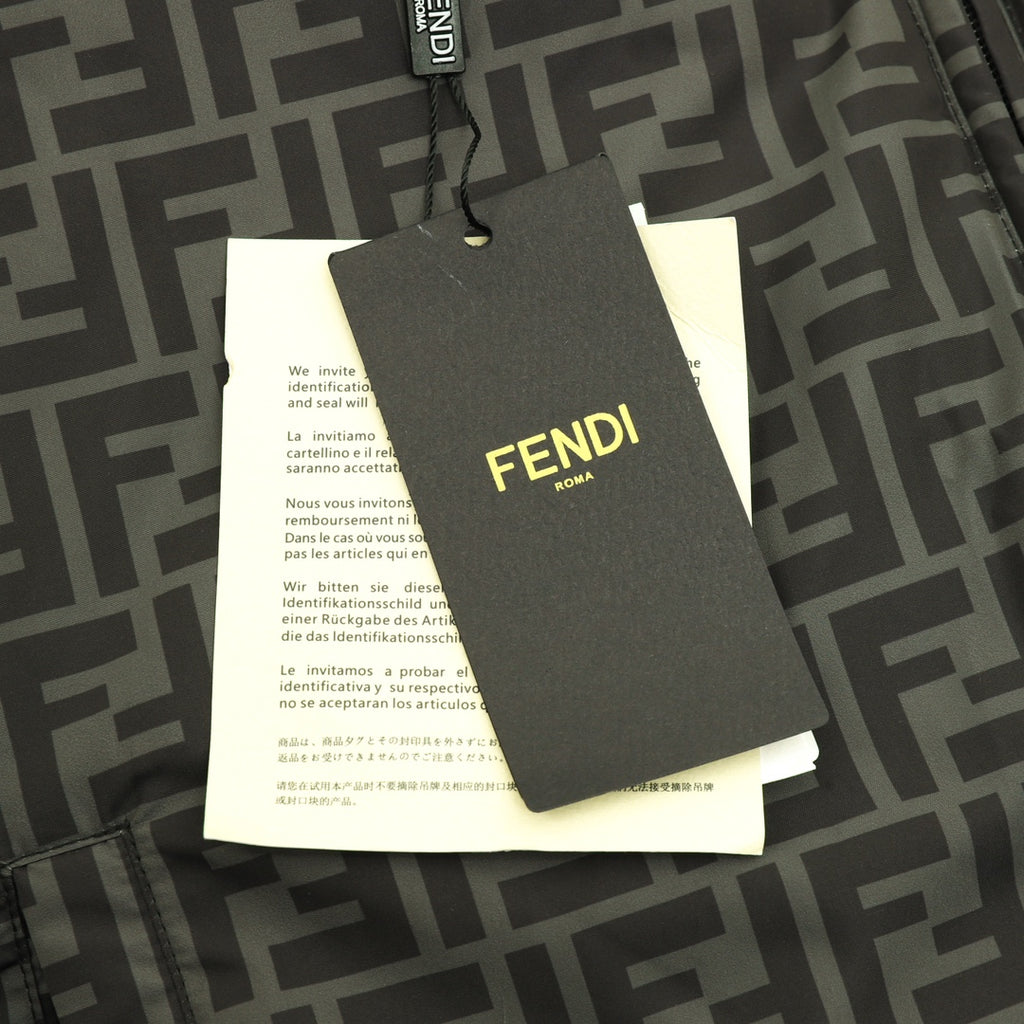 Fendi puffer jacket brand hang tag attached to patterned fabric