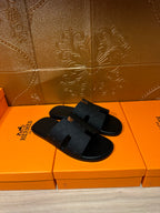 Black slide sandals with two-piece textured strap design