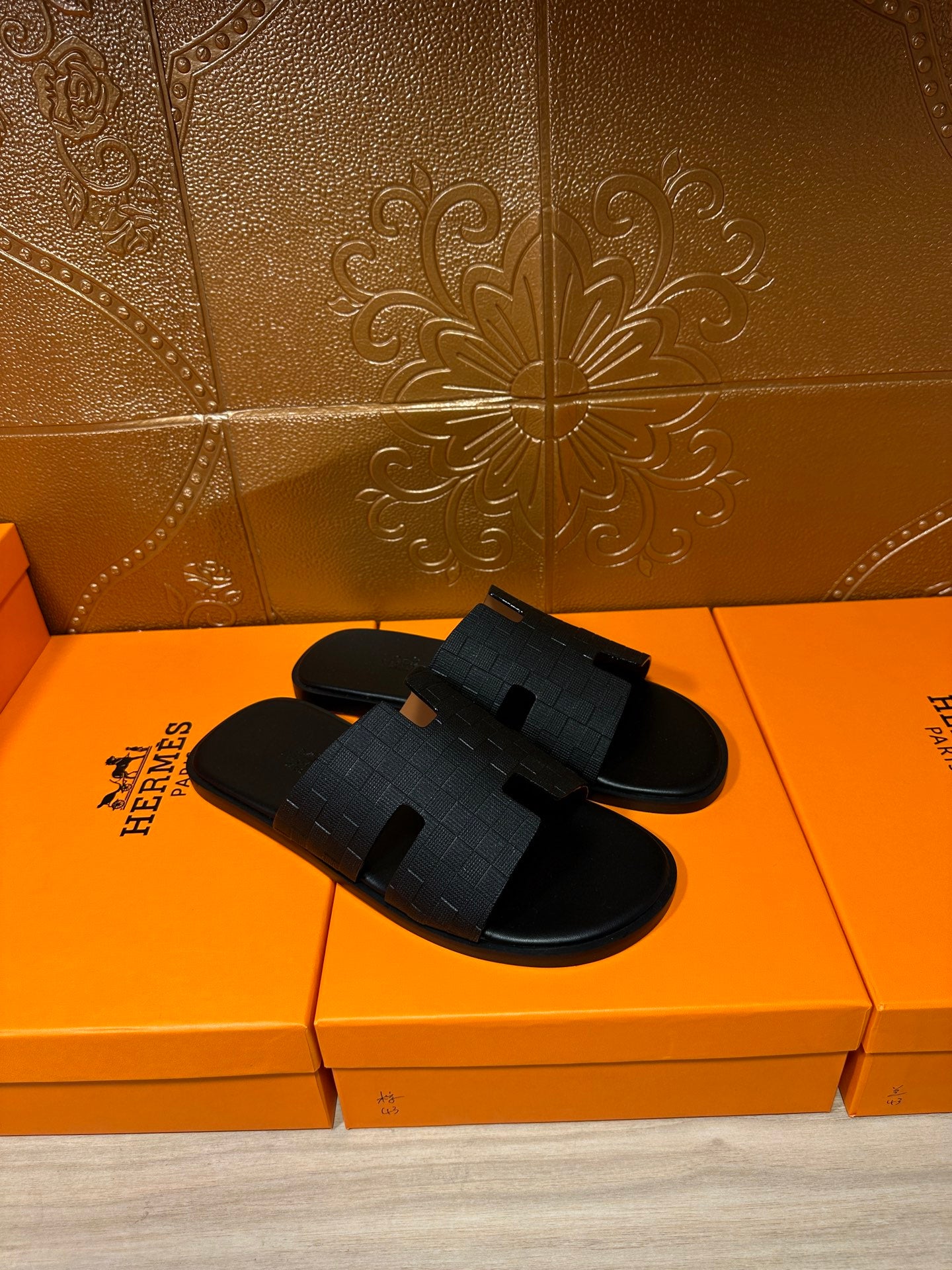 Black slide sandals with two-piece textured strap design