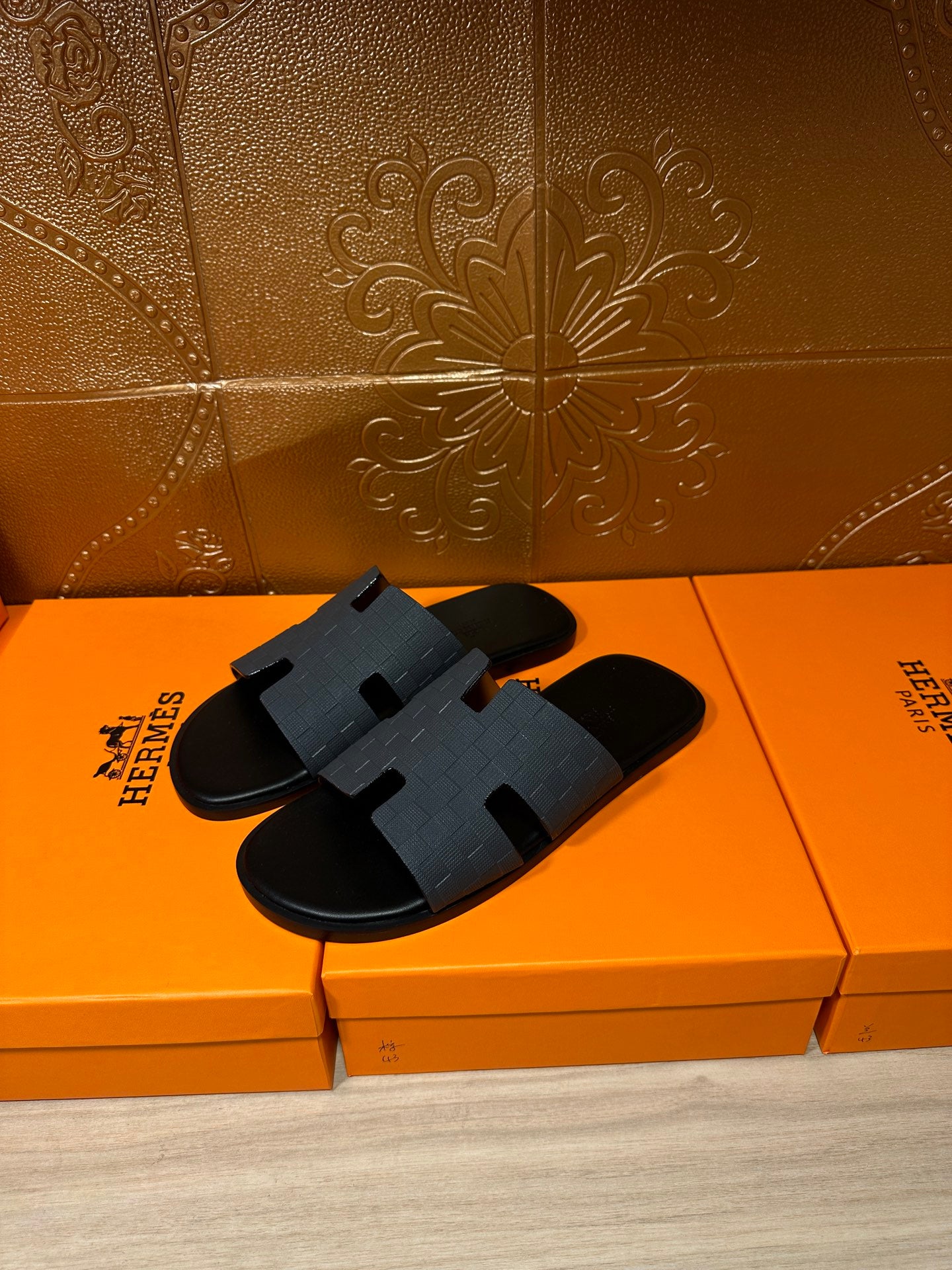 Hermes slide sandals, dark blue textured strap with molded H detail