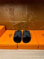 Hermes slide sandals in dark blue with molded H strap, open toe