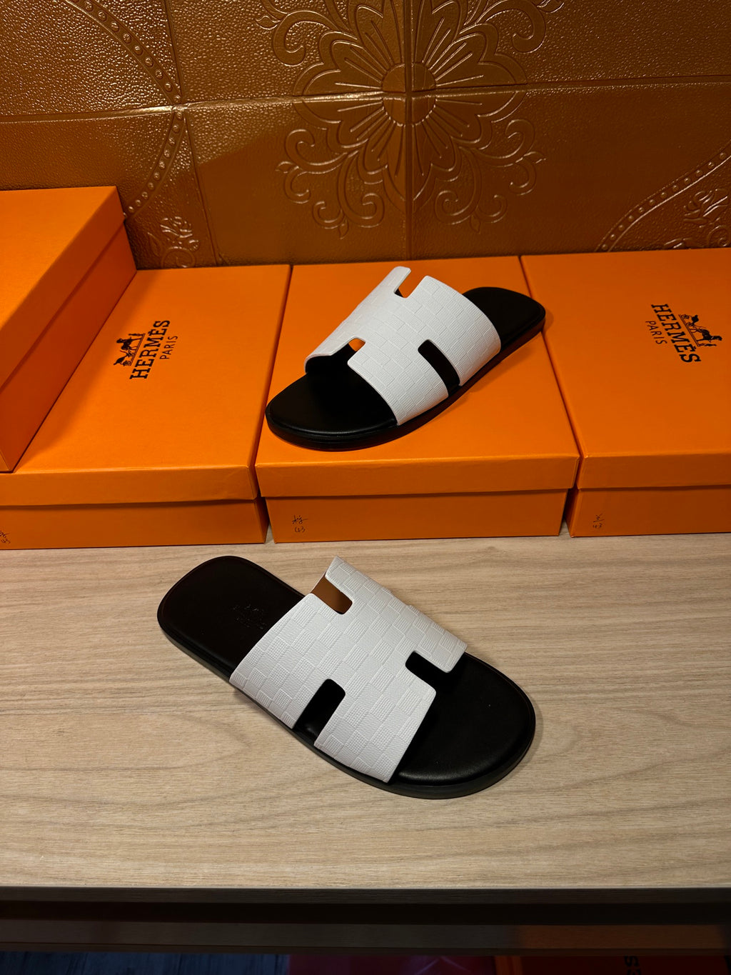 Hermes slide sandals with white straps and black footbed, H-cutout detail