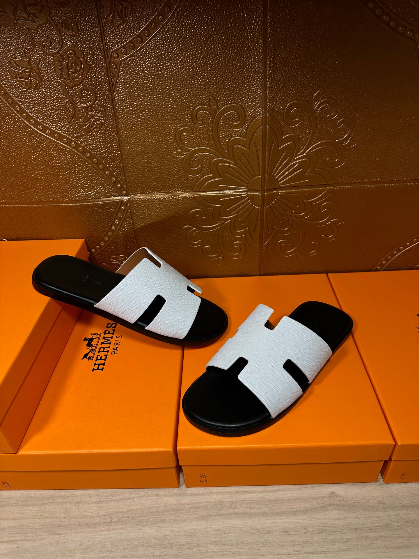 Hermes slide sandals set, white straps with black H-cutout detail on black footbeds