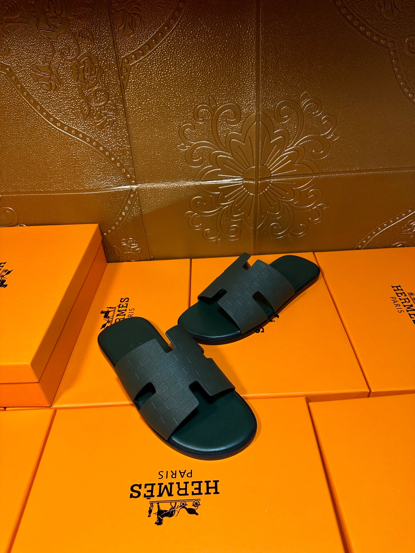 Hermes slide sandals, dark green with wide strap featuring an H cutout detail