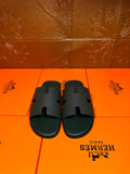 Hermes slide sandals, dark green with wide H-style strap and open toe design