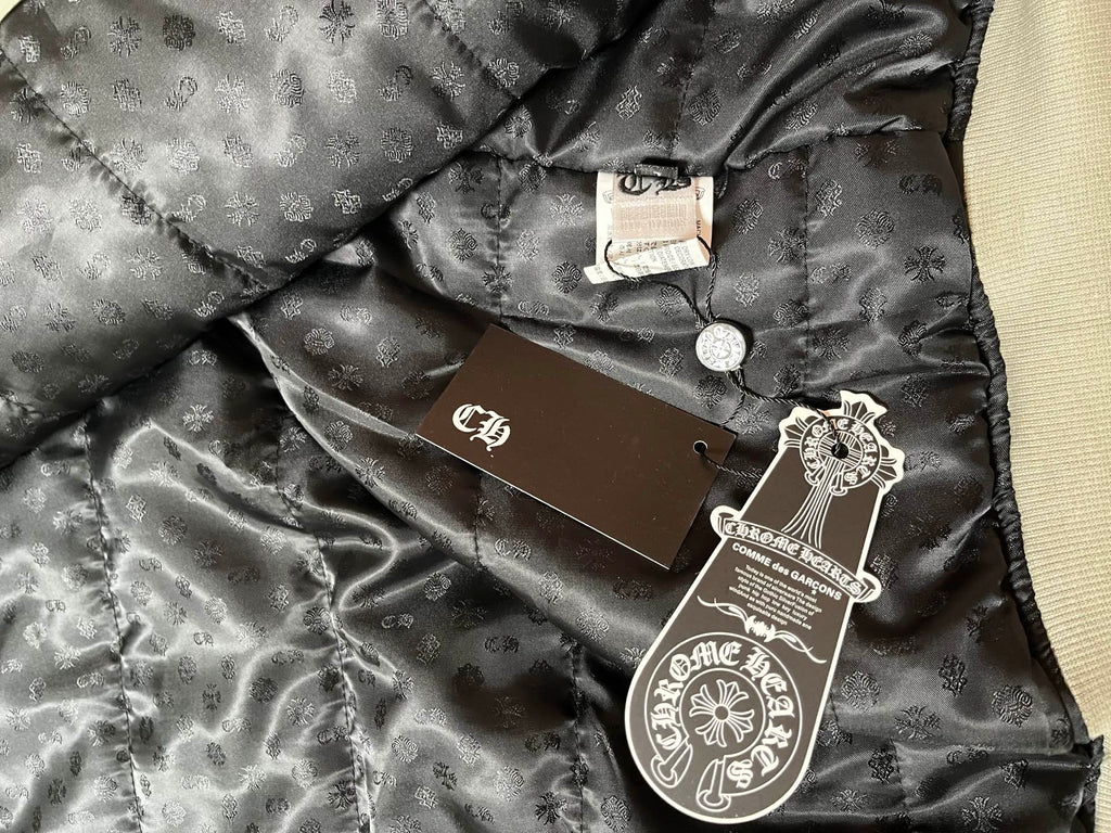 Black satin-lined inner jacket panel with hang tag and stamped label