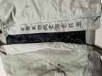Olive green jacket with patterned inner waistband and dark lining panel