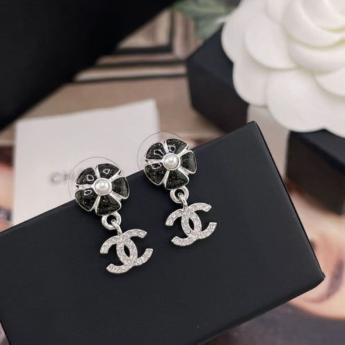 Chanel drop earrings: black flower studs with faux pearl and crystal CC charms