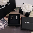 Chanel earrings in black gift box, silver flower studs with faux pearl and CC charms
