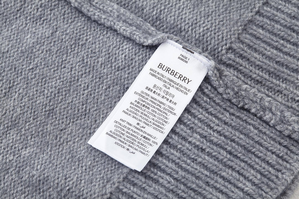 Grey knit sweater with crew neck and Burberry logo patch label