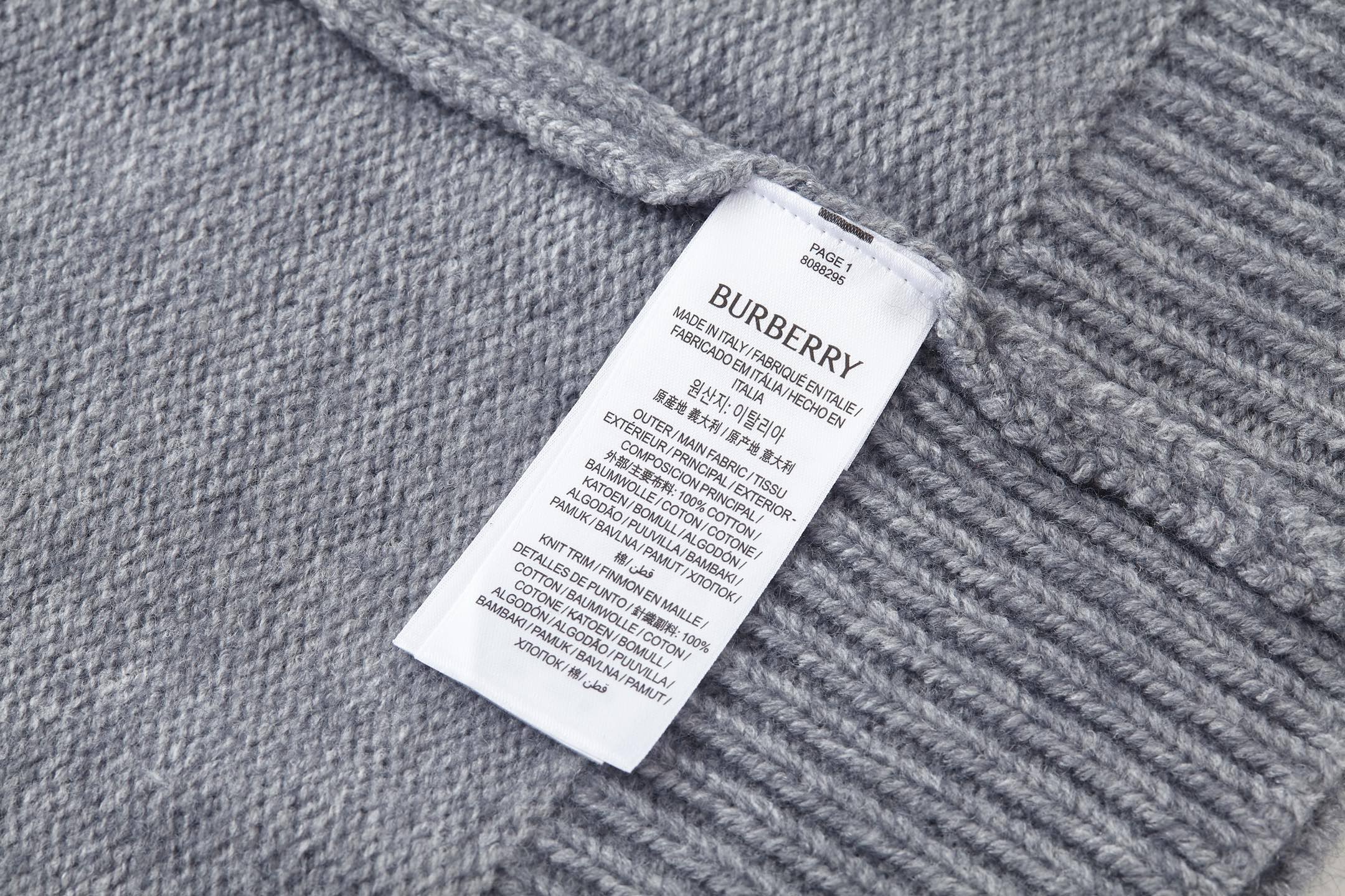Grey knit sweater with crew neck and Burberry logo patch label