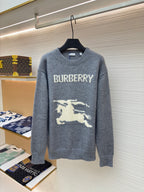 Gray long-sleeve knit sweater with “BURBERRY” text and white horse graphic.