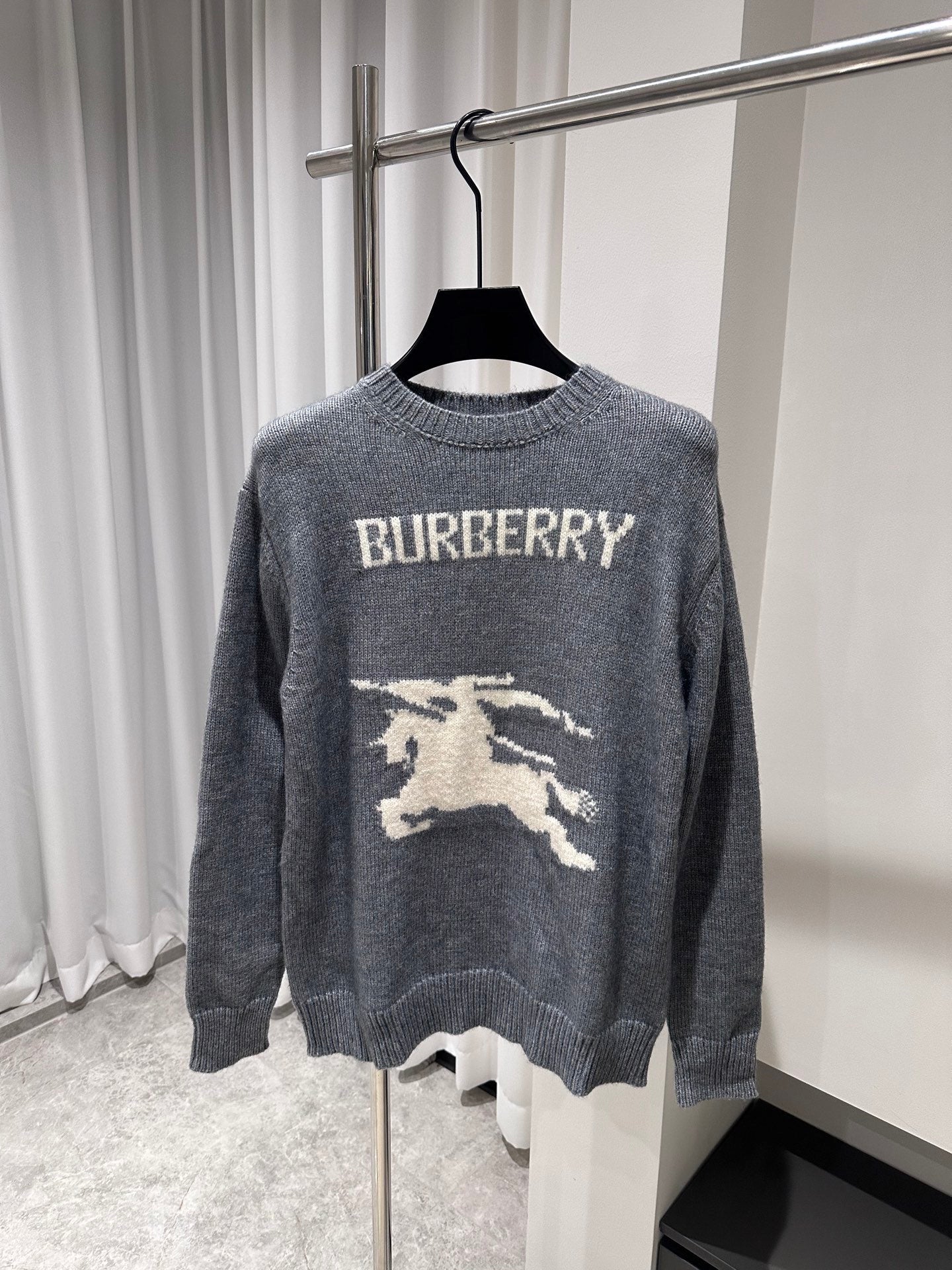Gray crewneck knit sweater with BURBERRY text and white horse graphic on front