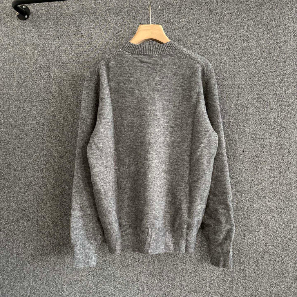 Gray crewneck knit sweater, plain back with ribbed hem and cuffs