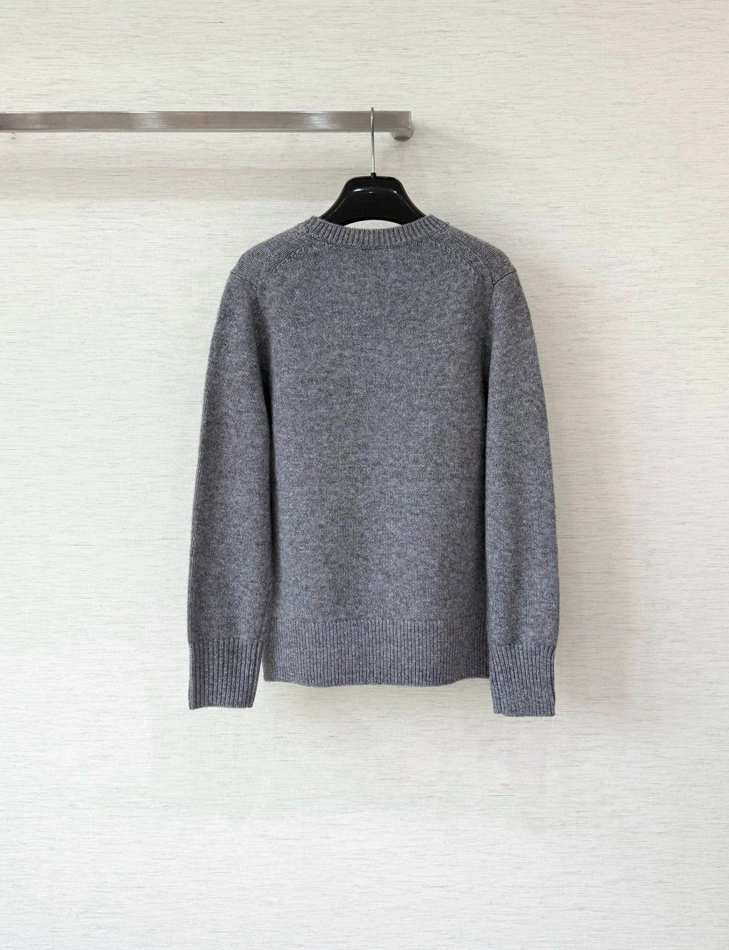 Grey long-sleeve sweater with ribbed crew neck and plain back