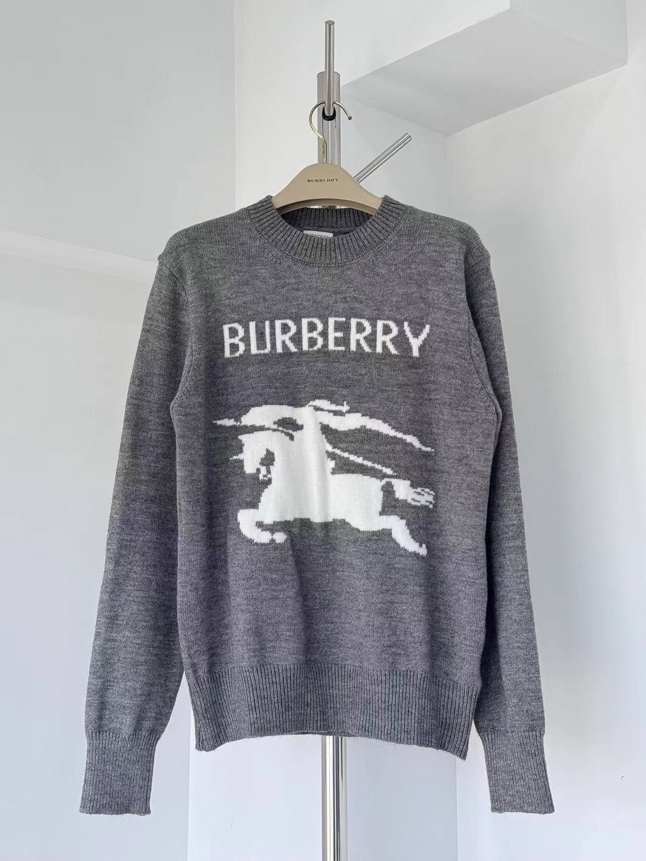 Gray crewneck knit sweater with BURBERRY label and white horse graphic on front