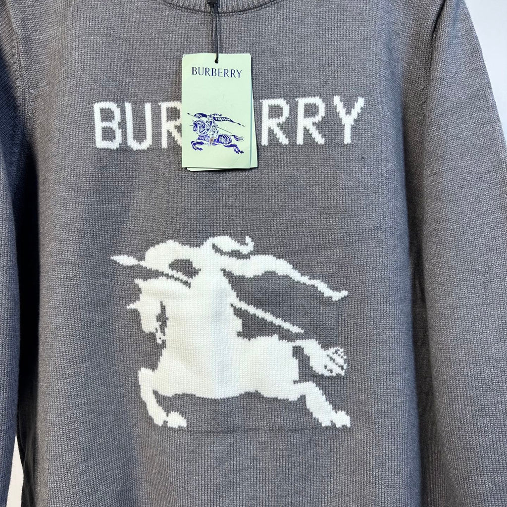 Gray Burberry knit sweater with 'BURBERRY' text and white horse emblem
