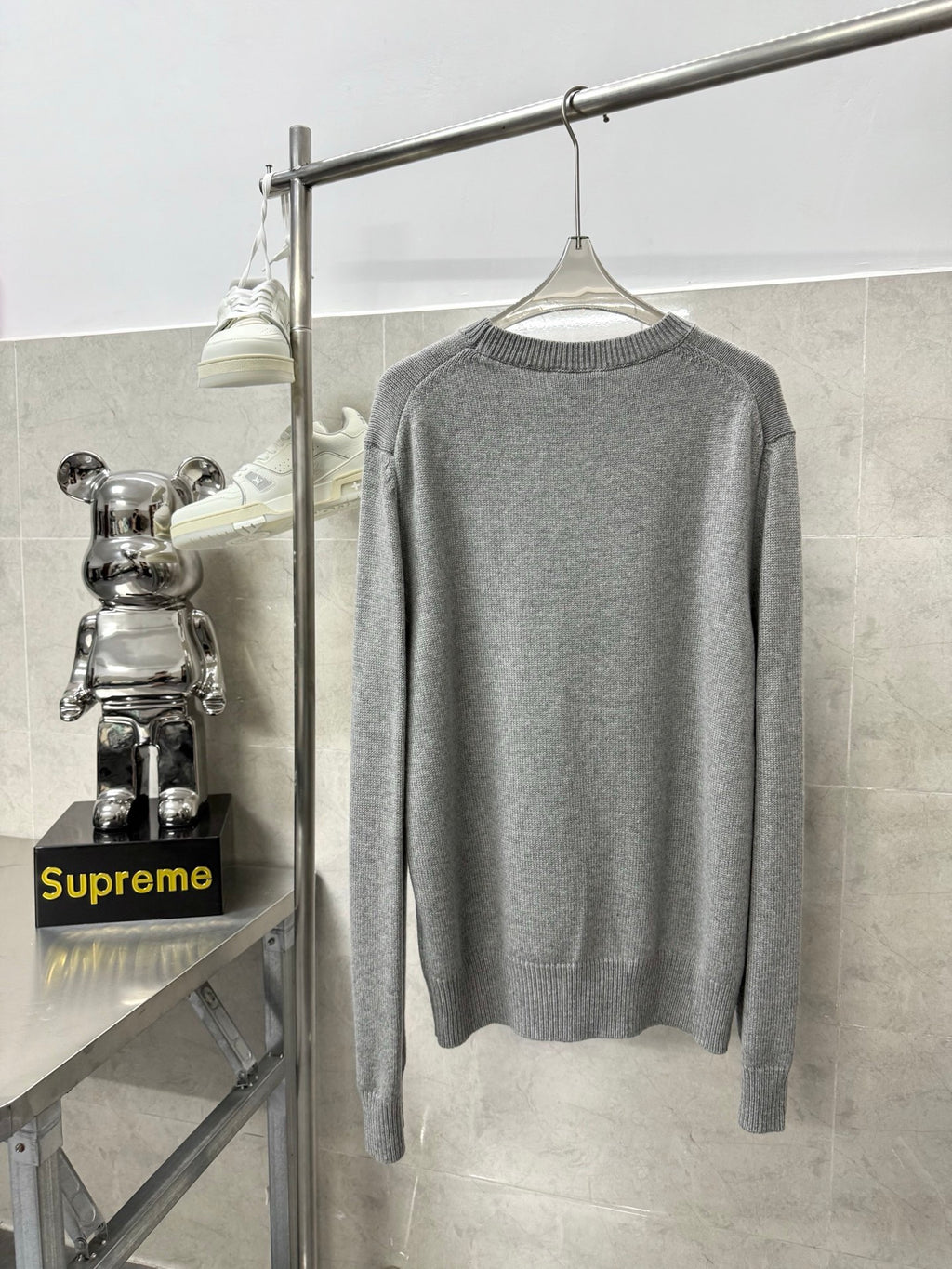 Gray crewneck knit sweater, plain back with ribbed hem and cuffs