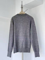 Gray crewneck knit sweater with ribbed cuffs and hem, plain back