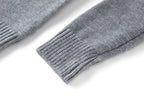 Grey rib-knit sweater sleeve cuff and hem detail