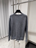 Gray crewneck knit sweater with ribbed hem and cuffs, plain back