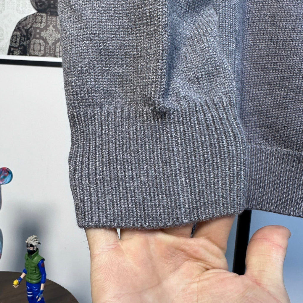 Gray Burberry knit sweater cuff and textured knit detail