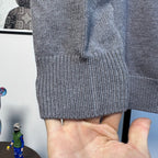 Gray Burberry knit sweater cuff and textured knit detail