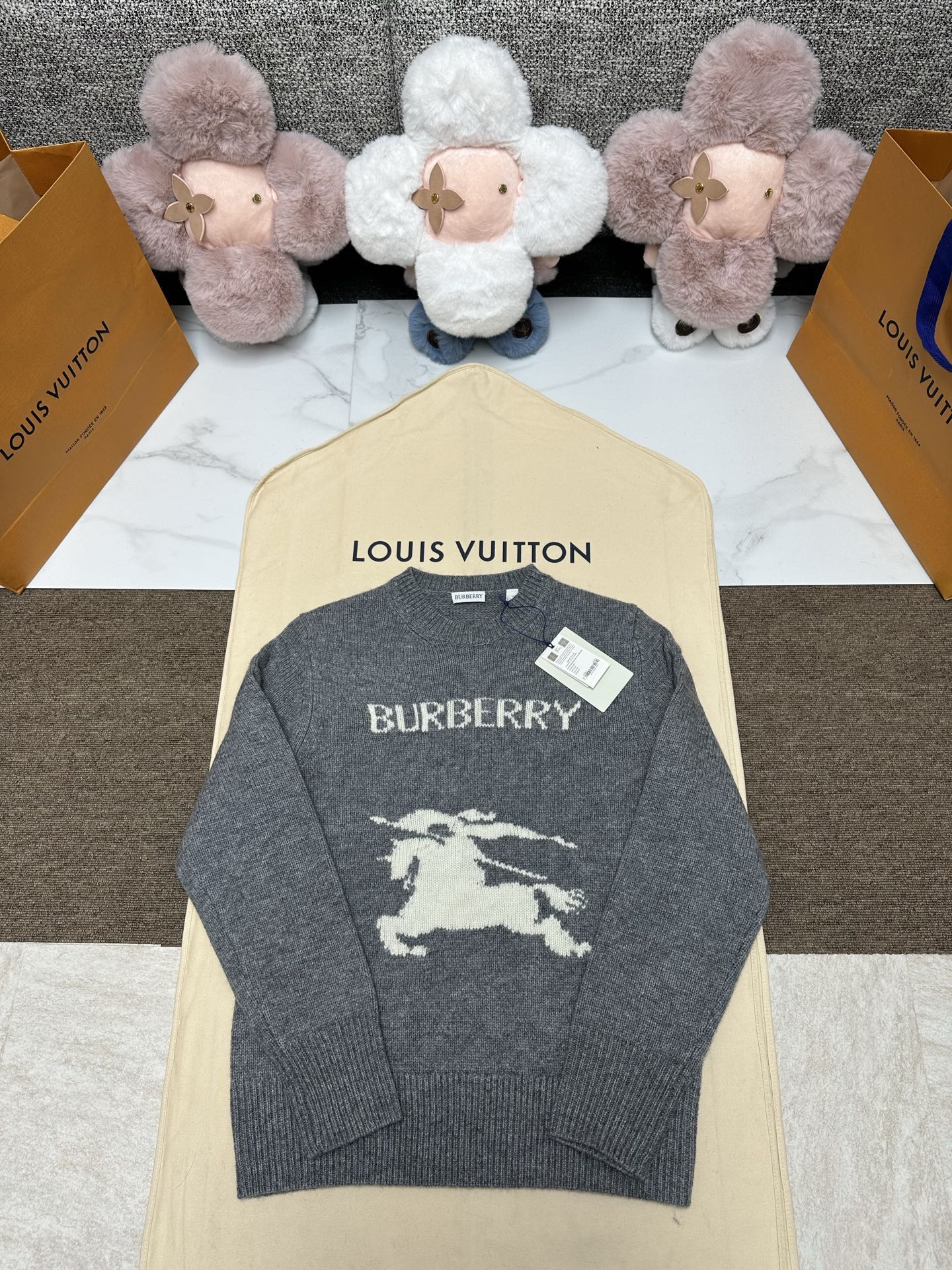 Grey knit sweater with BURBERRY text and horse graphic, crew neck