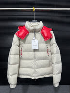 Long white puffer jacket with red shoulder panels and zip front, hood up