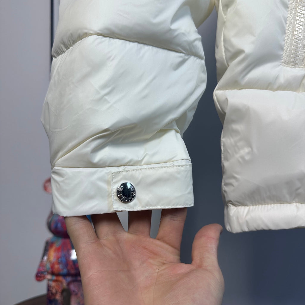 Moncler long puffer jacket sleeve cuff with round snap button