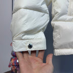 Moncler long puffer jacket sleeve cuff with round snap button