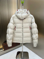 Long puffer jacket with attached hood, white quilted fill, red trim at shoulders
