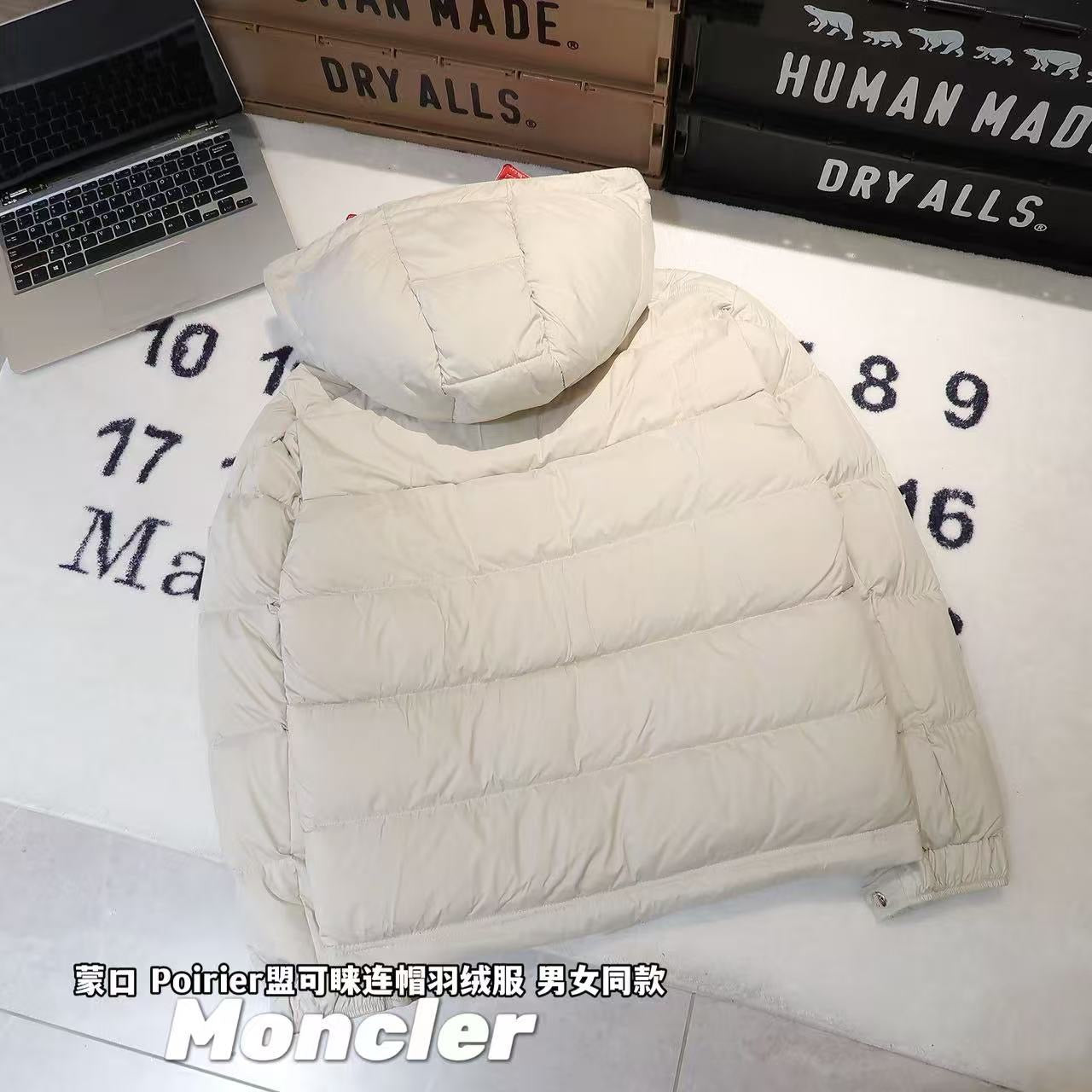 Long white puffer jacket with hood up and horizontal quilted sections