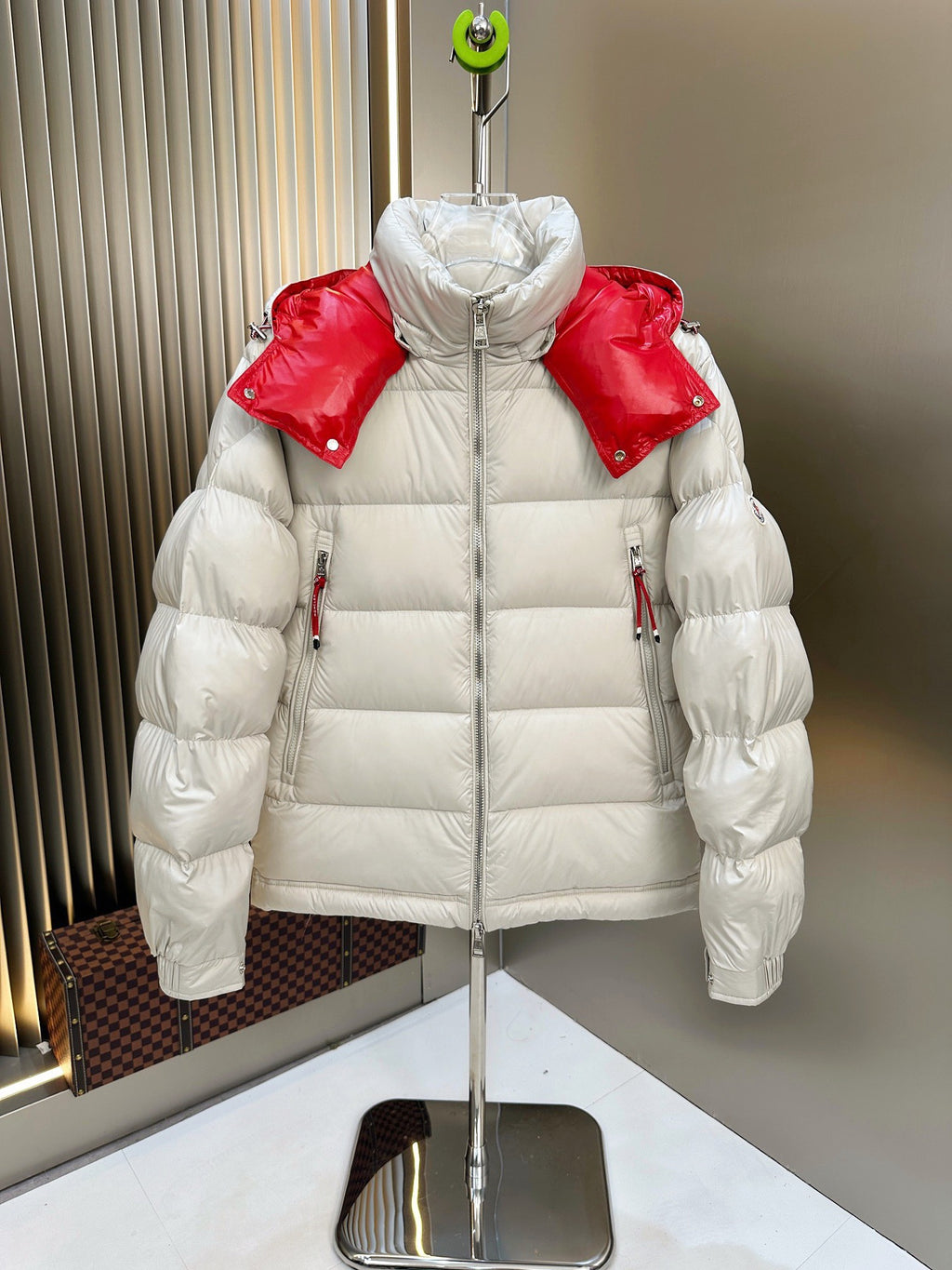 Long puffer jacket, white with red hood and shoulders, full-zip front and hood