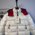 Moncler long puffer jacket front view, red shoulder panels and logo label