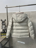 Long puffer jacket back view, white quilted insulation and hood with gathered edges