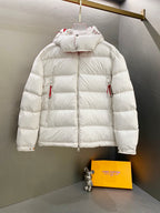 White long puffer jacket with hood, front zip, and two side pockets