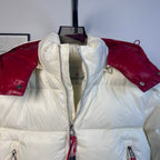 Moncler long puffer jacket torso detail, front zip and red shoulder panels