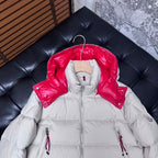 Moncler long puffer jacket with red hood lining, front zipper and logo sleeve patch