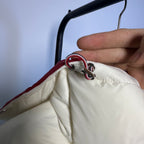 Moncler long puffer jacket with red-and-white drawstring hood trim