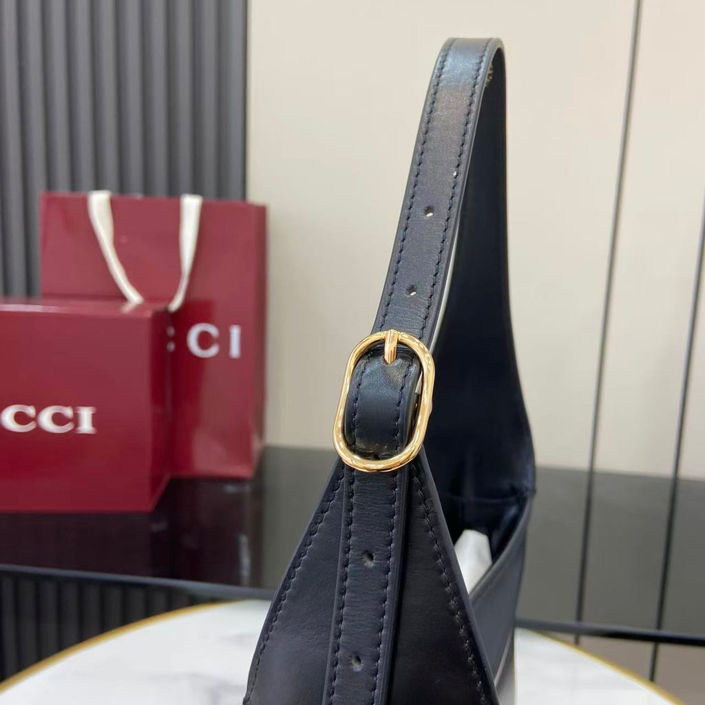 Black leather hobo bag handle with oval ring hardware and stitch detailing