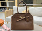 Brown leather handbag with top handles and front twist-lock detail