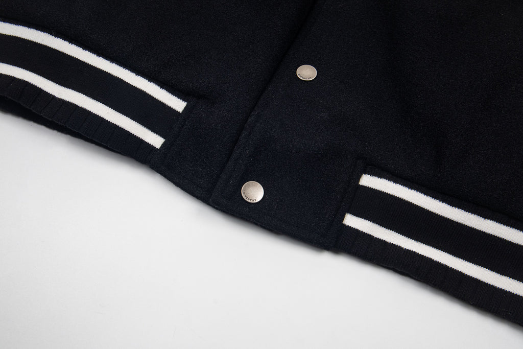 Givenchy black jacket cuff with white stripe trim and snap buttons