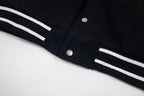 Givenchy black jacket cuff with white stripe trim and snap buttons