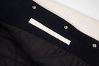 Givenchy black jacket front with white bar stripe, snaps, and quilted panel