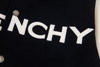 Close-up of GIVENCHY lettering on black varsity jacket front