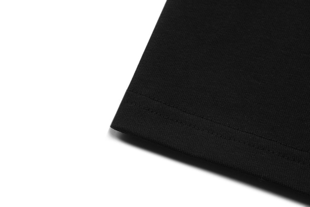 Black shorts fabric hem close-up