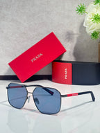 Sunglasses with blue-tinted lenses, dark metal frame, white temple tips