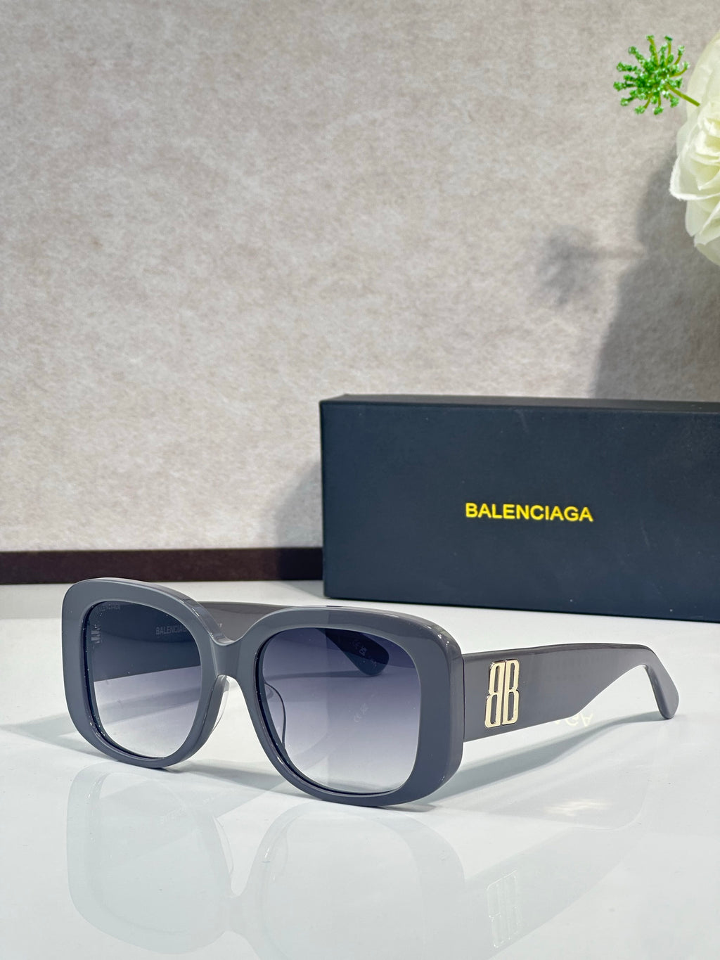 Balenciaga sunglasses with black-gray square frames and dark lenses