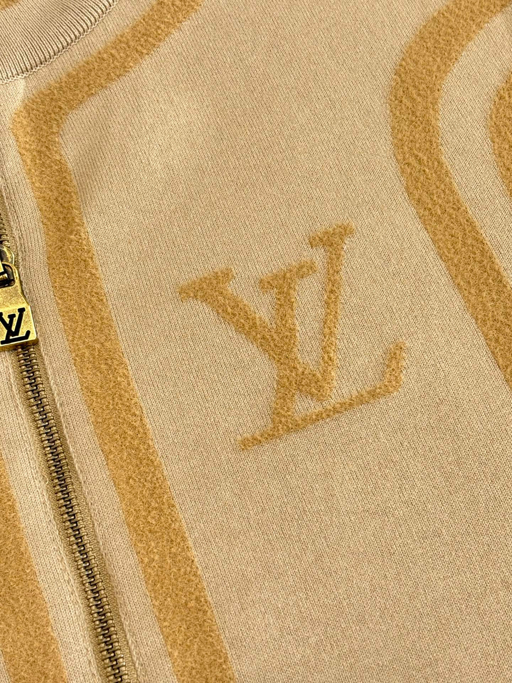 Beige knit fabric with Louis Vuitton monogram and gold stripe pattern